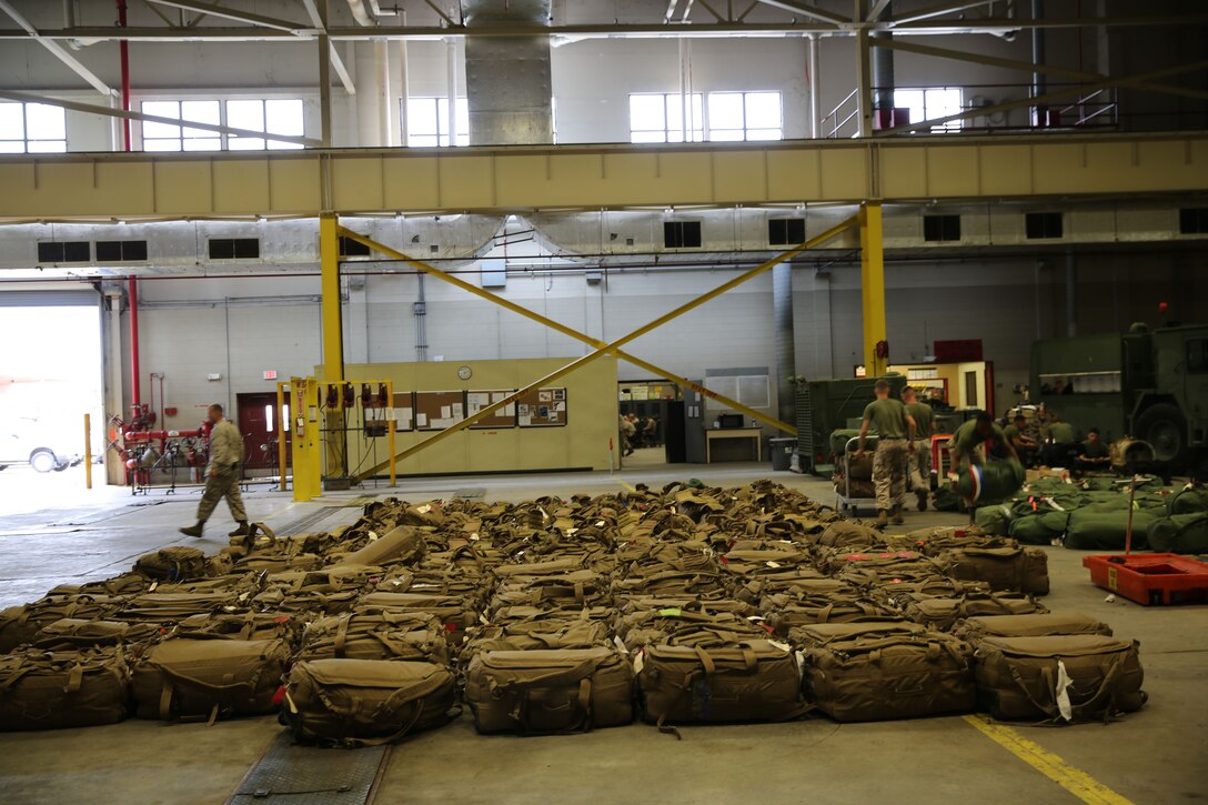 Luggage was laid out carefully for service members of Combat Logistics Regiment 2, 2nd Marine Logistics Group during a homecoming event held aboard Camp Lejeune, N.C., July 1, 2013. This made it easier for Marines and sailors to find their belongings and finally go home with their loved ones after being in Afghanistan for six months in support of Operation Enduring Freedom. (U.S. Marine Corps photo by Lance Cpl. Shawn Valosin)