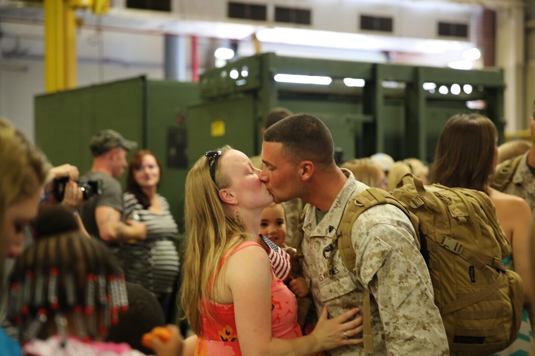 Marines and sailors from Combat Logistics Regiment 2, 2nd Marine Logistics Group were greeted with hugs and kisses during a homecoming event aboard Camp Lejeune, N.C., July 1, 2013. These service members were the first wave of CLR-2 members to return from Afghanistan. (U.S. Marine Corps photo by Lance Cpl. Shawn Valosin)