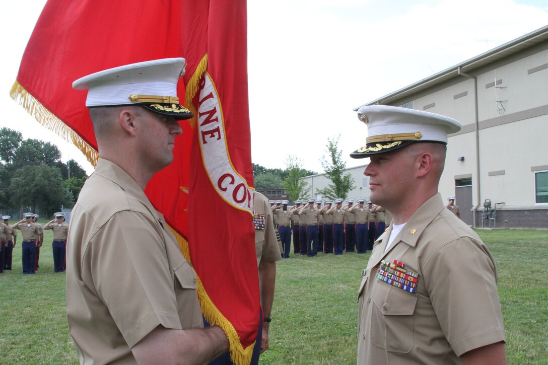 Maj. Paul Bock (left) accepts Recruiting Station Frederick’s colors in recognition of taking command from Maj. James Birchfield, III during RS Frederick’s change of command ceremony, June 28, in Frederick, Md. Birchfield received a Meritorious Service Medal for a successful tour of duty as the commanding officer of RS Frederick. 