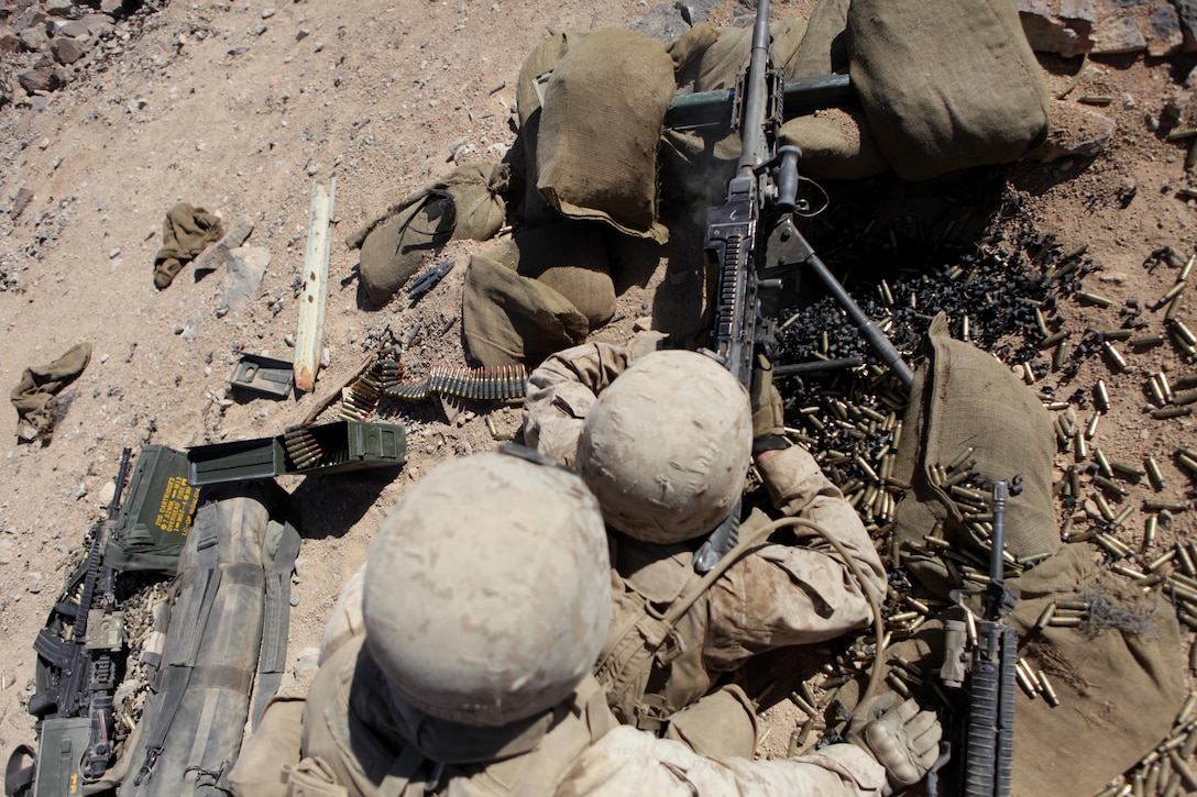 TWENTYNINE PALMS, Calif. – Machine gunners with Company B, 1st Battalion, 24th Marine Regiment, fire toward “enemy” positions during a training exercise at Marine Corps Air-Ground Combat Center here, June 18. Range 410A allows Marines the opportunity to work on small-unit leadership by completing a series of obstacles that involve a platoon-sized element. Range 410A is part of Integrated Training Exercise 4-13, a cornerstone of the Marine Air-Ground Task Force Training Program. ITX is the largest annual U.S. Marine Corps Reserve training exercise, utilizing assets from ground, air and logistic combat elements to create a live, virtual and constructive battalion exercise.(U.S. Marine Corps photo by Cpl. John M. McCall) 