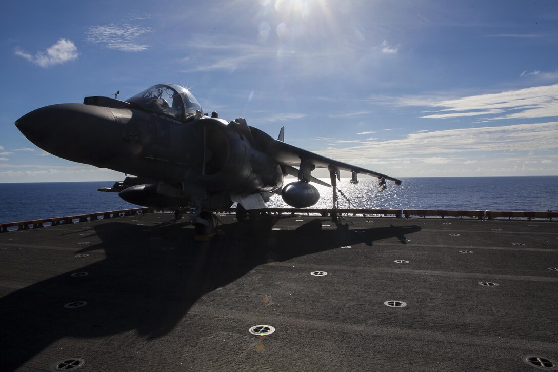 An AV-8B Harrier II attached to Marine Medium Tiltrotor Squadron 265 (Reinforced), 31st Marine Expeditionary Unit, sits on the port aircraft elevator here, June 28. The Harrier is a short takeoff and vertical landing jet designed to attack surface targets under any day and night conditions. The Harrier is the only fixed wing aircraft capable of deploying with the MEU because of its ability to use the shorter decks of the LHD/A class amphibious assault ships. The 31st MEU is the only continuously forward-deployed MEU and is the Marine Corps’ force in readiness in the Asia-Pacific region. 