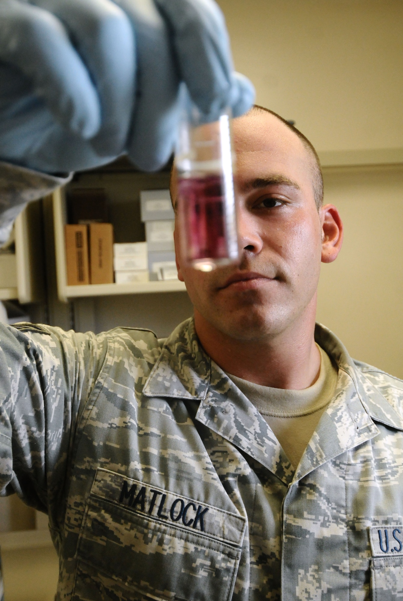 Staff Sgt. John Matlock, 36th Medical Operations Squadron Bioenvironmental Flight bioenvironmental engineering technician, tests a water sample for chlorine and pH levels on Andersen Air Force Base, Guam, July 2, 2013. The flight takes monthly samples from various locations on base to ensure the water supply remains safe to use. (U.S. Air Force photo by Airman 1st Class Mariah Haddenham/Released)