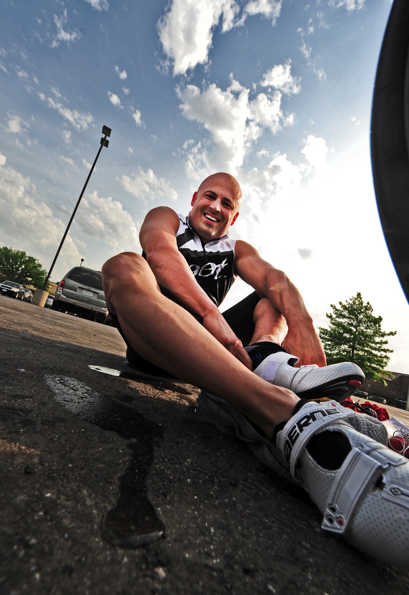 1st Lt. Kevin Knutson, 509th Logistics Readiness Squadron, changes into cycling shoes after completing a 420-meter swim during a triathlon at Whiteman Air Force Base, Mo., June 21, 2013. Out of 36 participants, Knutson finished the race in sixth place with a time of 57 minutes and 13 seconds. (U.S. Air Force photo by Staff Sgt. Nick Wilson/Released) 