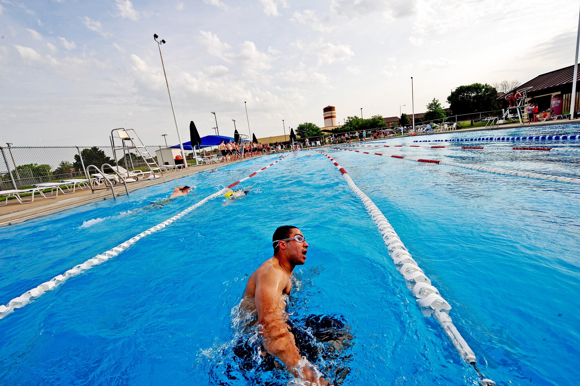 Airman 1st Class Kaleb Bawden, 509th Security Forces Squadron, competes in the 420-meter swim portion of a triathlon at Whiteman Air Force Base, Mo., June 21, 2013. Out of 36 participants, Bawden finished in eighth place with a time of 57 minutes and 32 seconds. (U.S. Air Force photo by Staff Sgt. Nick Wilson/Released)