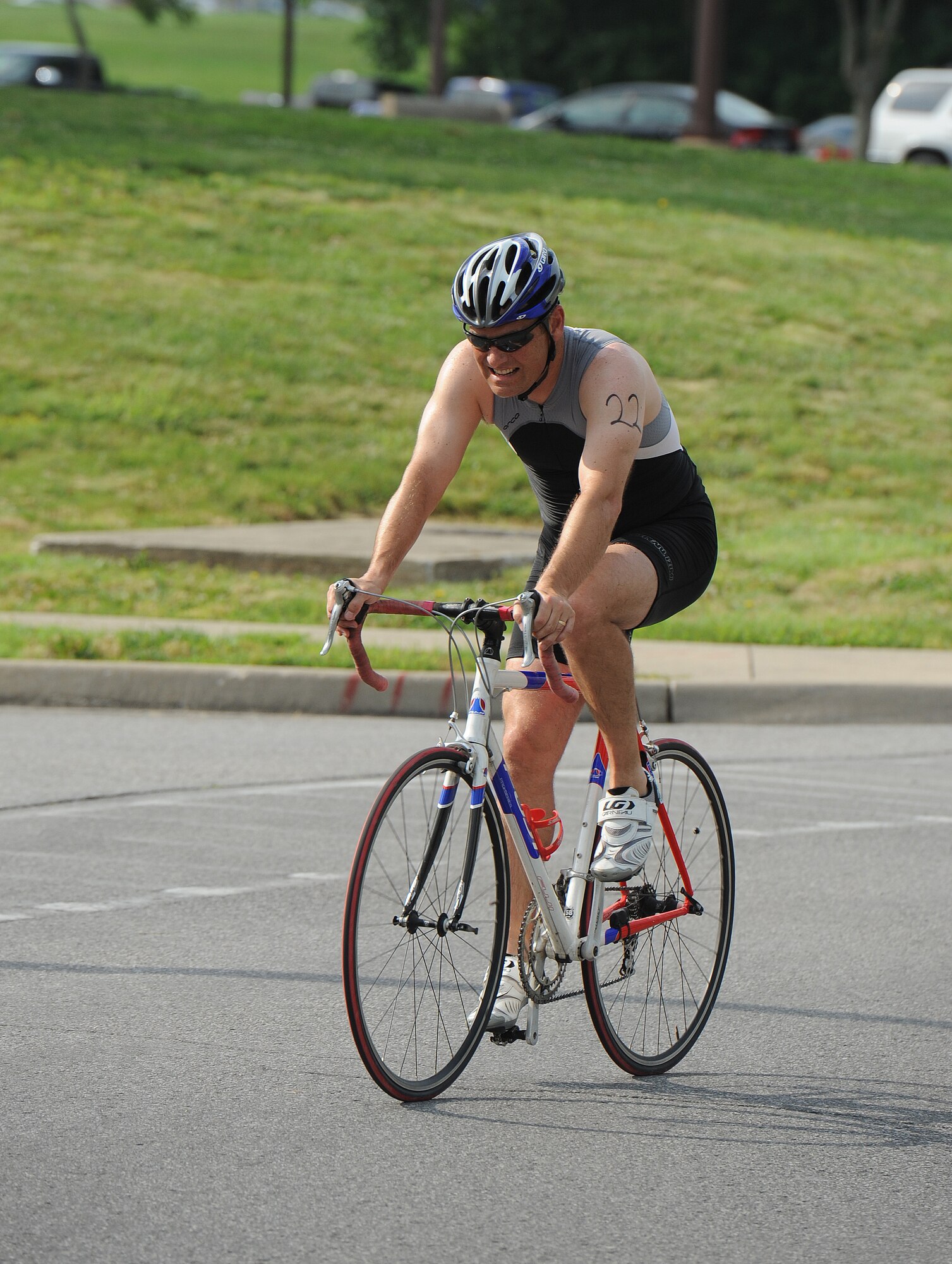 Lieutenant Col. Michael Leonas, 442nd Operations Group commander, completes the final stretch of a 10-kilometer bicycle race during a triathlon at Whiteman Air Force Base, Mo., June 21, 2013. Leonas finished the race in the top 30 percent with a time of 1 hour, 1 minute and 15 seconds. (U.S. Air Force photo by Staff Sgt. Nick Wilson/Released)