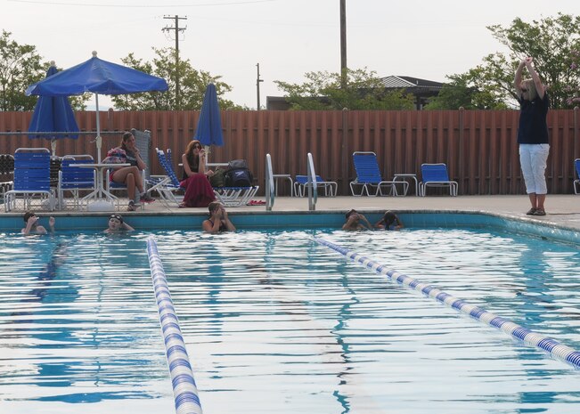 Jeanene Graves, 9th Force Support Squadron youth sports and fitness director, coaches the Beale Barracudas swim team during practice at the base pool at Beale Air Force Base, Calif., July 2, 2013. The Barracudas are a recreational swim team focused on self improvement and goal achievement. (U.S. Air Force photo by Senior Airman Allen Pollard/Released)