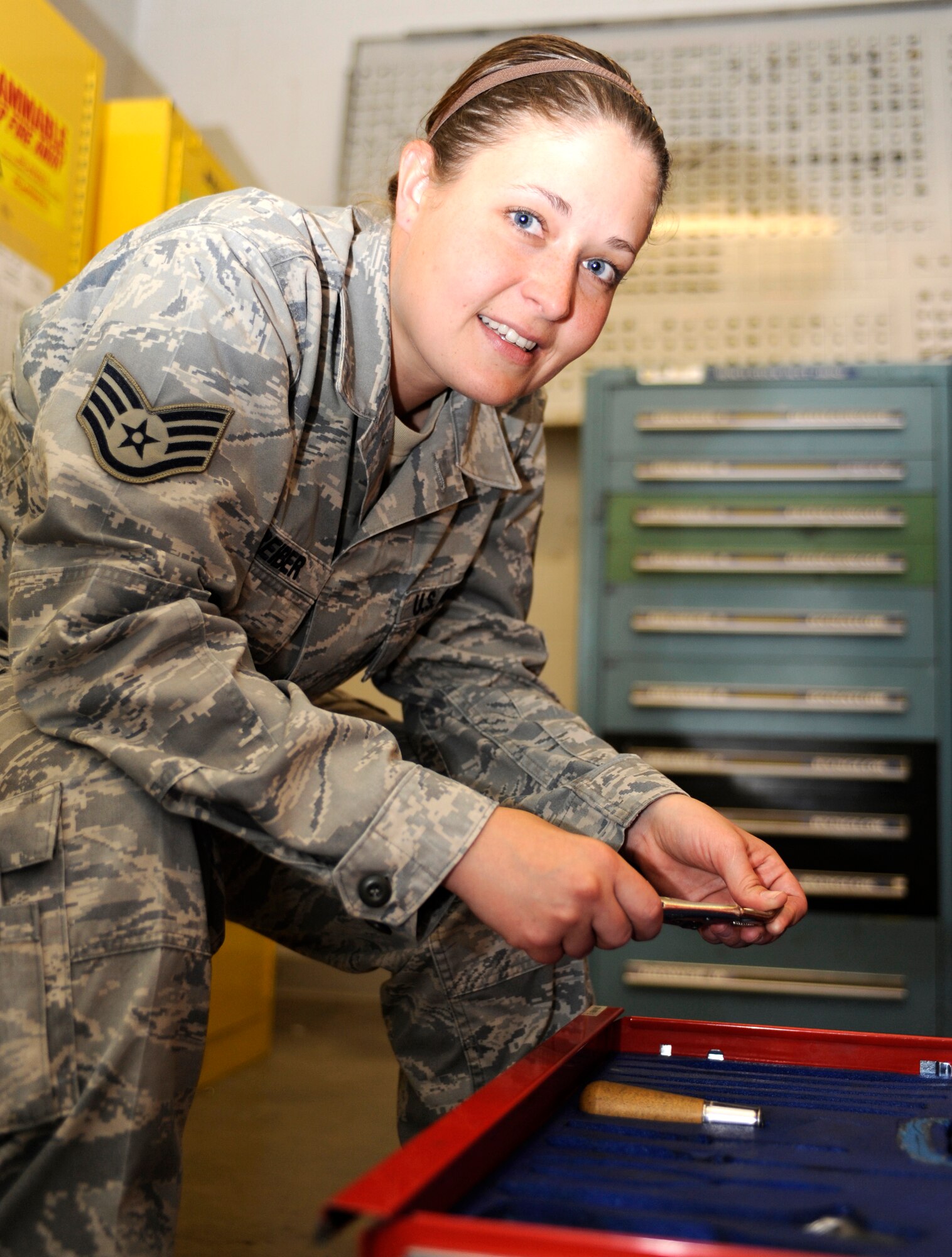 Staff Sgt. Janet Schreiber, 28th Maintenance Squadron aircraft structural maintenance support section NCO in charge and one of the base's 32 victim advocates, inventories a tool chest in Bldg. 7520 at Ellsworth Air Force Base, S.D., June 28, 2013. Schreiber has been a victim advocate for one year, and prides herself on providing sexual assault victims with any type of support they may need. (U.S. Air Force photo by Airman 1st Class Ashley J. Thum/Released)