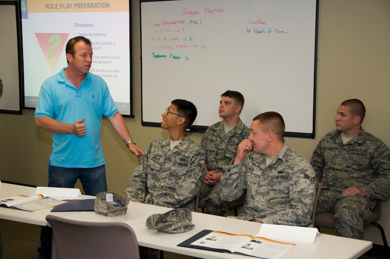 Tim Hahn, 436th Airlift Wing Safety Office occupational safety and health specialist, explains the roles Airmen will be acting out in a scenario during “Alive at 25” defensive driving course June 26, 2013, Dover Air Force Base, Del. “Alive at 25” was initially brought to Dover AFB in 2007 to help combat the high amount of Airmen involved in alcohol-related driving offenses, and has helped reduce the number of offense by 33 percent over the past five years .(U.S. Air Force photo/Senior Airman Jared Duhon)