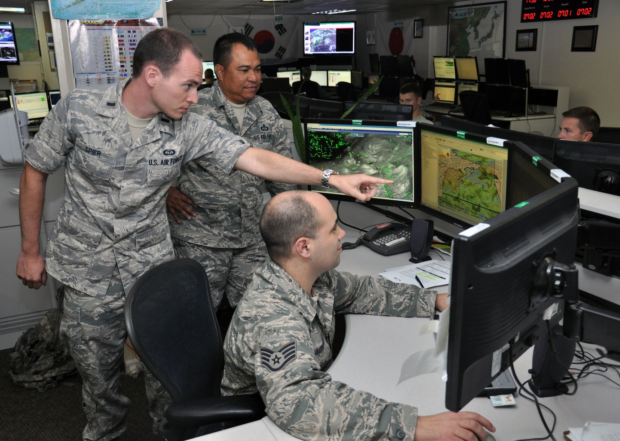 1st Lt. Andrew Spier, 17th Operational Weather Squadron Officer in Charge,
Senior Master Sgt. Greg Espinosa, Flight Chief of Contingency Operations,
and Staff Sgt. Arthur Gonzalez, West Zone Forecast Supervisor, monitor
weather forecasting equipment to provide constant updates on incoming
weather patterns to service members throughout the Pacific theater. The 17th
OWS provided detailed weather forecasts of Mount Everest to the Airmen from
the USAF 7 Summits team enabling mountaineers to become the first U.S.
military team to summit the peak.