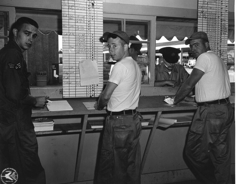 Motor Vehicle Section, Left to Right, #1, Unk, #2 Unk, #3 In Background Window, Unk, #4 Facing through Window  with Head Down, Unk, #5 John Guy  (Photo by NCANG Heritage Program)