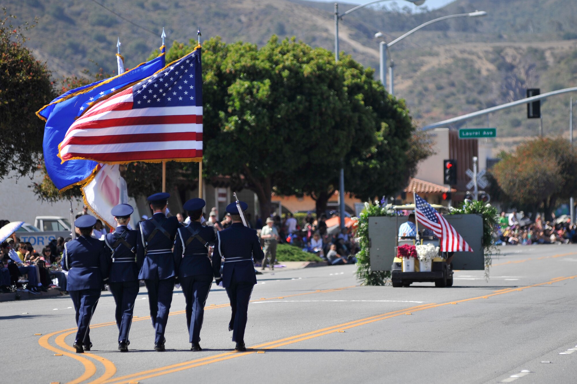 LOMPOC, Calif. -- Members of the Vandenberg Honor Guard team march through the city of Lompoc during the city's 61st annual Flower Festival Parade on Saturday, June 29. The team was selected to lead the procession for the parade which was themed "A Salute to the Red, White and Blue". (U.S. Air Force photo/Michael Peterson)