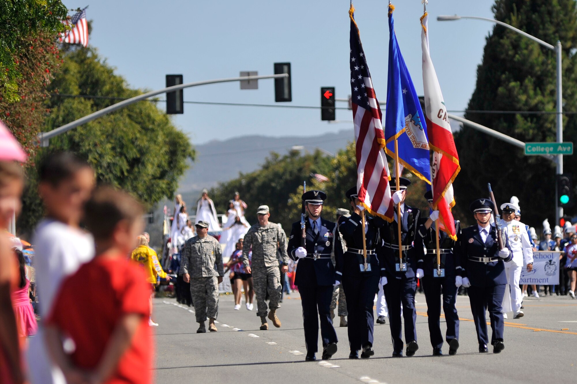 LOMPOC, Calif. -- Members of the Vandenberg Honor Guard team march through the city of Lompoc during the city's 61st annual Flower Festival Parade on Saturday, June 29. The team was selected to lead the procession for the parade which was themed "A Salute to the Red, White and Blue". (U.S. Air Force photo/Michael Peterson)