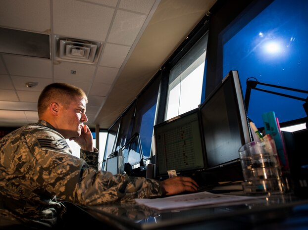 Staff Sgt. Brad Dawson, 437th Maintenance Group Air Terminal Operation Center controller, checks the schedule of aircraft that will be arriving on the flight line, June 25, 2013, at Joint Base Charleston – Air Base, S.C. (U.S. Air Force photo/ Senior Airman Dennis Sloan)