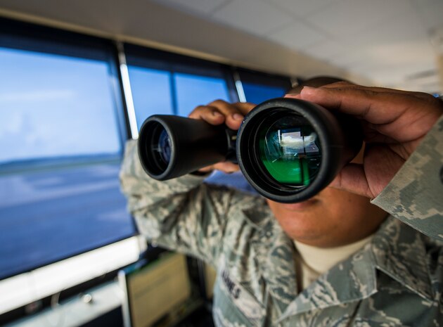 Staff Sgt. Vincent Barnes, 437th Maintenance Group Air Terminal Operation Center controller, scans the Joint Base Charleston – Air Base flight line while in the ATOC, June 25, 2013, at JB Charleston – Air Base, S.C. ATOC controllers are the eyes and ears of the flight line, checking tail numbers and making sure all aircraft are in the correct place. (U.S. Air Force photo/ Senior Airman Dennis Sloan)