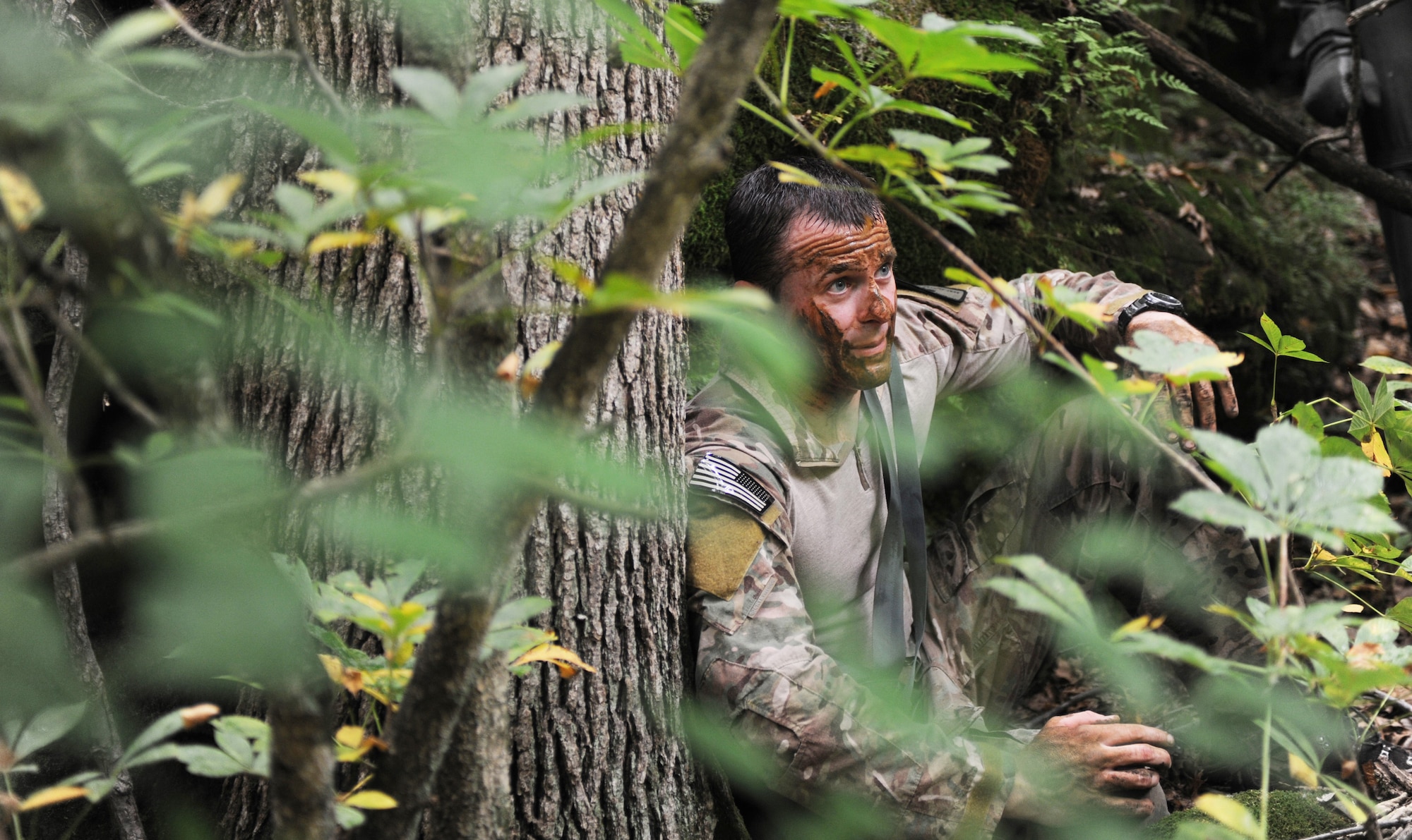 Staff Sgt. Clifton Cleveland, 509th Operations Support Squadron Survival, evasion, resistance and escape specialist, explains the process of gathering materials and seeking shelter to B-2 Spirit pilots during mandatory survival training, Whiteman Air Force Base, Mo., June 27, 2013.  (U.S. Air Force photo by Staff Sgt. Alexandra M. Boutte/Released)