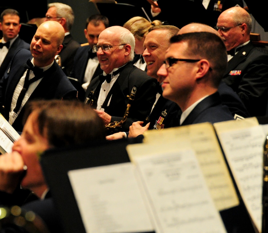 Members of The U.S. Air Force Band prepare to perform during a band Alumni Reunion Concert at West Potomac High School in Alexandria, Va., June 29, 2013. The three-day reunion allowed former members and conductors to participate in several performances and events with current bandsmen. (U.S. Air Force photo/Airman 1st Class Erin O’Shea) 