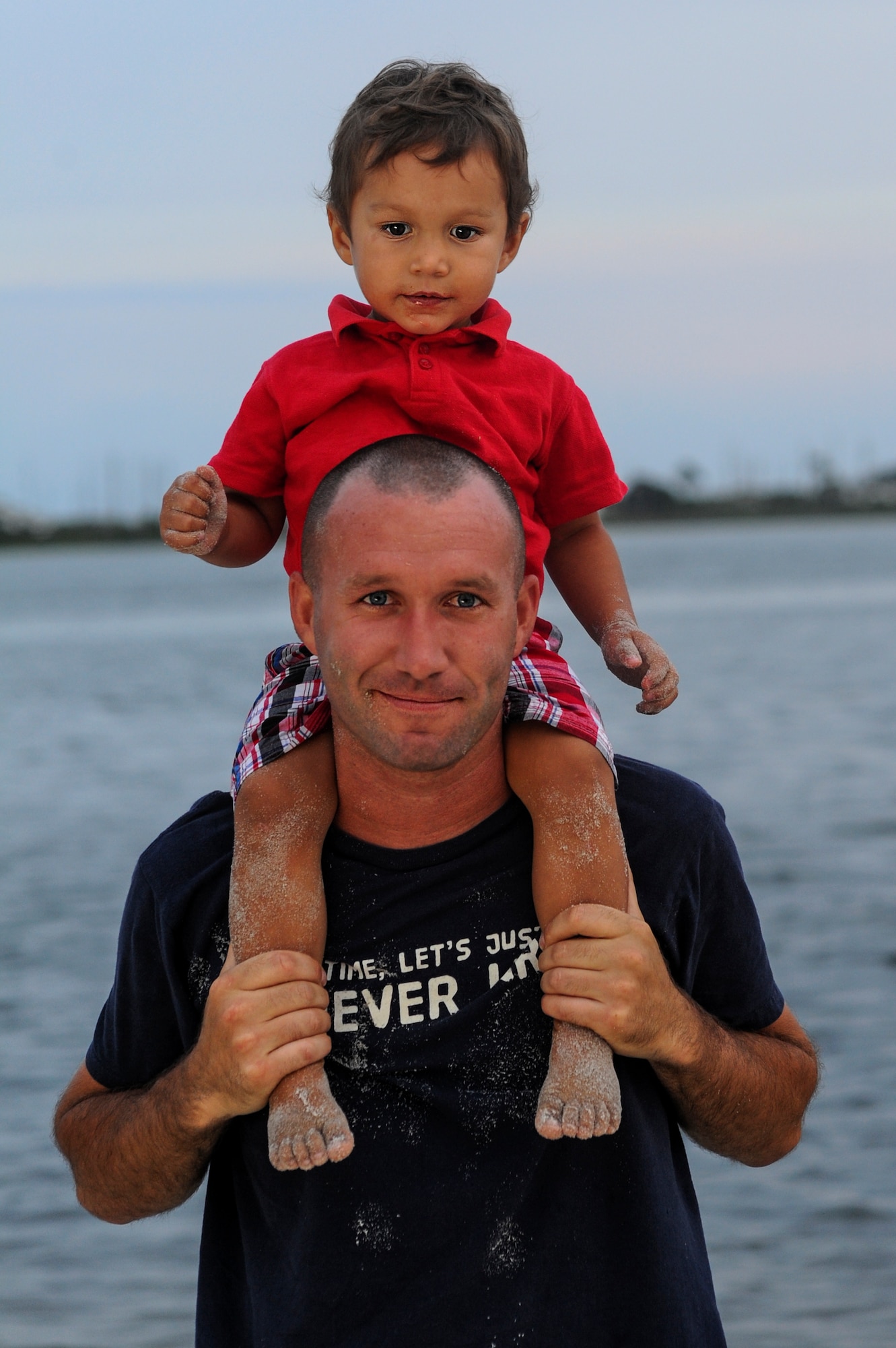 U.S. Marine Sgt. Robert Soates, Marine Fighter Attack Training Squadron 501, plays with his kid at the 18th Annual Sound of Independence celebration on Hurlburt Field, Fla., June 28, 2013. Squadrons from all across base worked in a number of different support positions to make sure everything’s ready to go so the military community could have an enjoyable experience. (U.S. Air Force photo/Airman 1st Class Christopher Callaway)