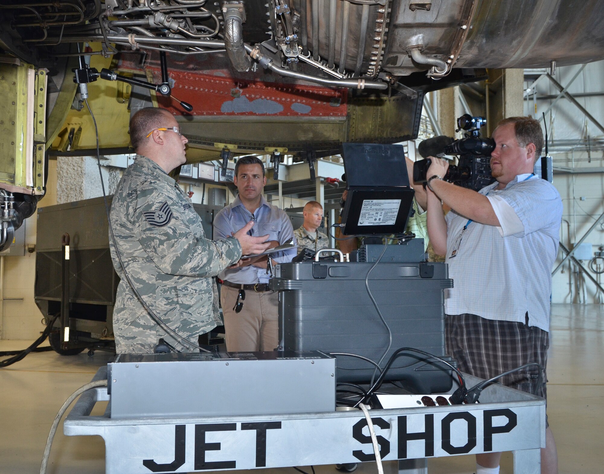Fox 6’s television news crew from Milwaukee Wisconsin receive a demonstration of jet engine bore scope operations by Technical Sgt. Eric Breitzman (left) at the 128th Air Refueling Wing, Wisconsin Air National Guard, June 28, 2013. The Milwaukee news teams were invited to attend a media engagement event at the air wing to learn more about the KC135R flight simulator and phase maintenance of the KC135R aircraft. (U.S. Air Force photo by Senior Master Sgt. Jeff Rohloff/Released)