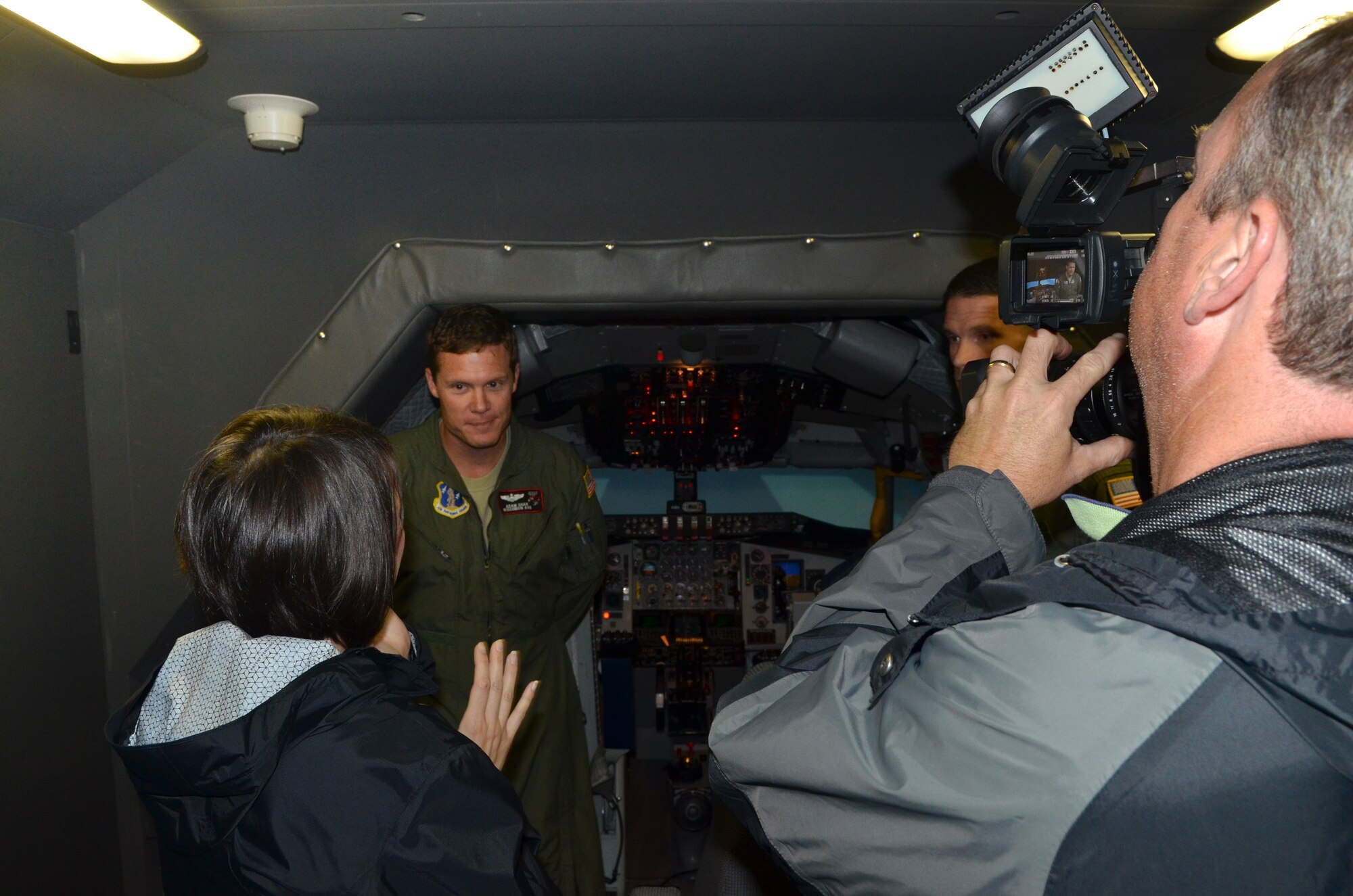 Major Adam Uhan of the 128th Air Refueling Wing, Wisconsin Air National Guard talks to a news crew from WISN TV 12 Milwaukee before receiving a training flight in a KC-135R simulator, June  28, 2013. The Milwaukee news teams were invited to attend a media engagement event at the air wing to learn more about the KC135R flight simulator and phase maintenance of the KC135R aircraft. (U.S. Air Force photo by Senior Master Sgt. Jeff Rohloff/
Released)