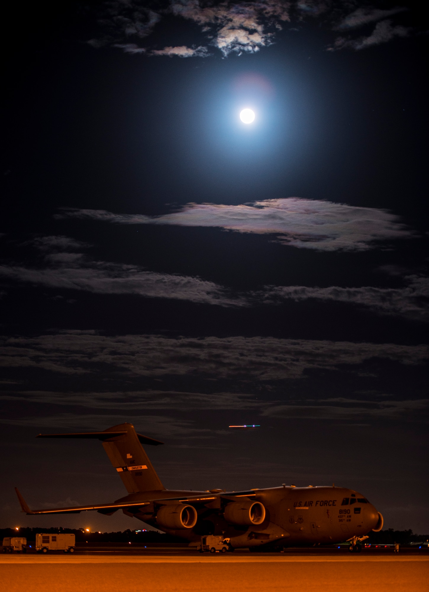A full moon rises over a C-17 Globemaster III June 22, 2013, at Joint Base Charleston –Air Base, S.C. The full moon that occurred June 22 was considered a supermoon 10 percent visibly larger than any other full moon during the year. (U.S. Air Force photo/ Senior Airman Dennis Sloan)
