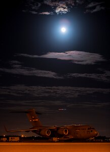 A full moon rises over a C-17 Globemaster III June 22, 2013, at Joint Base Charleston –Air Base, S.C. The full moon that occurred June 22 was considered a supermoon 10 percent visibly larger than any other full moon during the year. (U.S. Air Force photo/ Senior Airman Dennis Sloan)