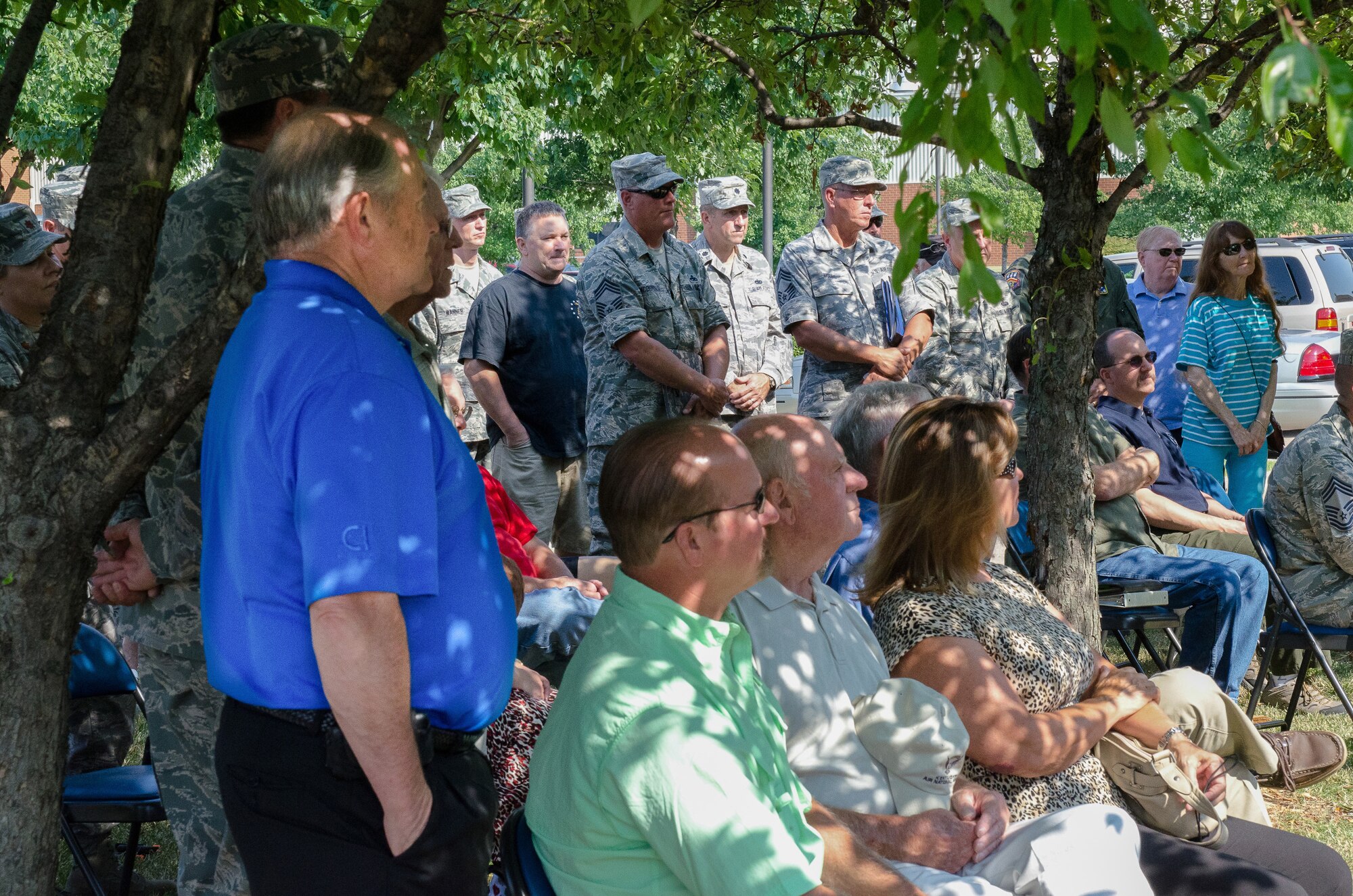 Current and former members of the 123rd Airlift Wing gather at the Kentucky Air National Guard Base in Louisville, Ky., June 22, 2013, for a ceremony to unveil a marble tablet honoring retirees. The black granite slab lists the names of Airmen who served at least 20 years and were honorably retired or transferred from the Kentucky Air National Guard during 2011 and 2012. (U.S. Air National Guard photo by Airman Joshua Horton)