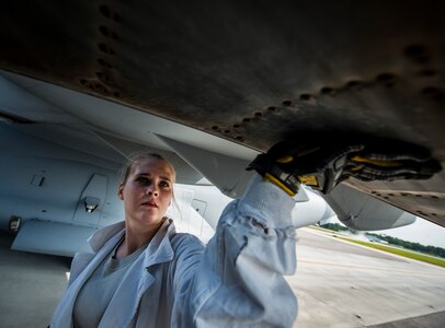 Staff Sgt. Jennifer Smith, 437th Maintenance Group jet-propulsion specialist, runs her hand along the bottom of a C-17 Globemaster III engine inspecting for cracks, bumps or other flaws during a routine maintenance check June 26, 2013, at Joint Base Charleston – Air Base, S.C. Airmen from the 437th MXG perform routine maintenance to  C-17s daily. (U.S. Air Force photo/ Senior Airman Dennis Sloan)