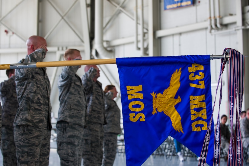 The 437th Maintenance Operations Squadron guidon is displayed in formation during the 437th Maintenance Operations Squadron inactivation ceremony June 28, 2013, at Joint Base Charleston – Air Base, S.C. The 437th MOS activated in October 2002. (U.S. Air Force photo/ Senior Airman George Goslin)