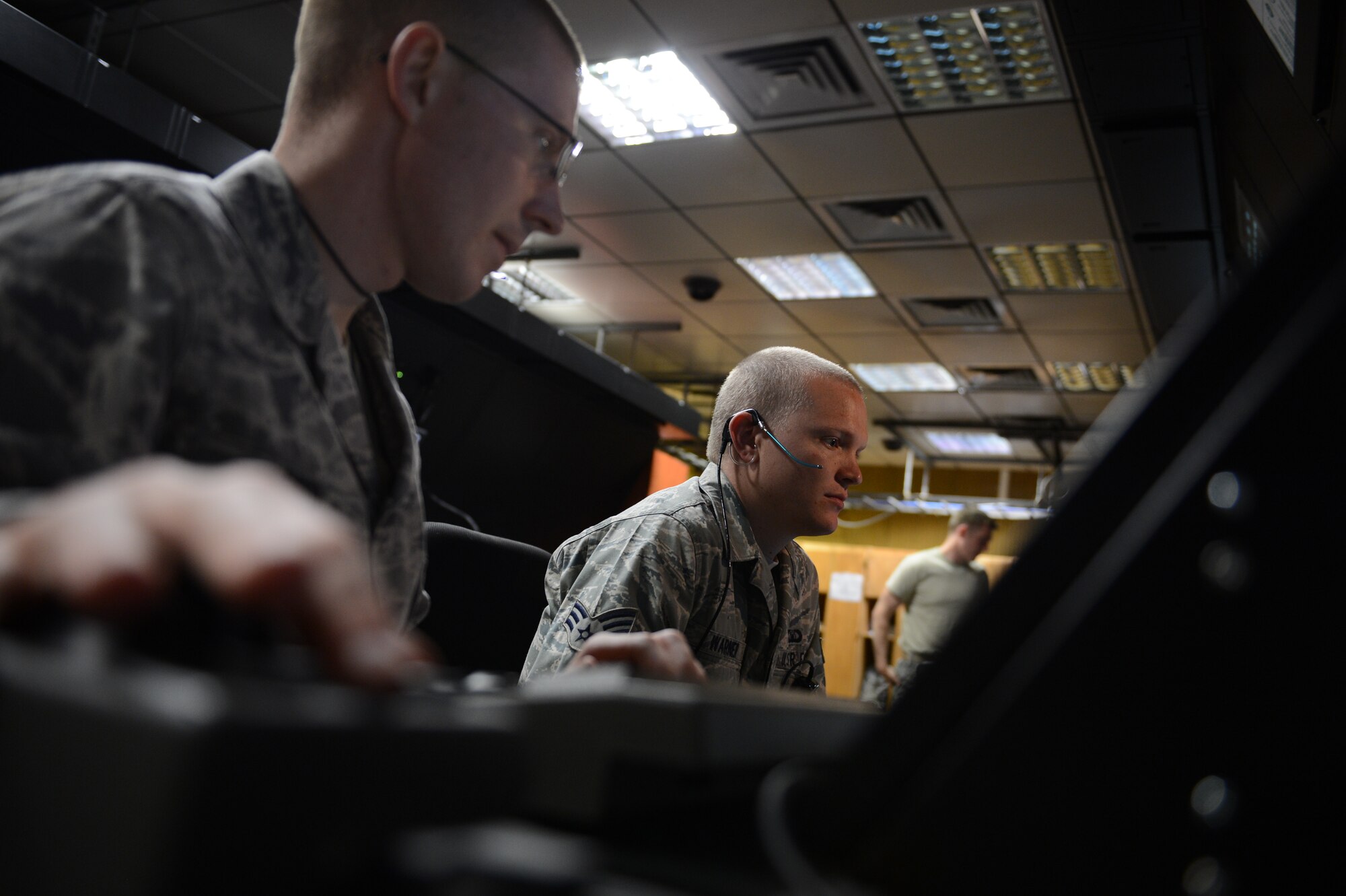 SPANGDAHLEM AIR BASE, Germany – U.S. Air Force Staff Sgt. Andrew Reed and Senior Airman Ryan Warner, both air traffic controllers from the 52nd Operations Support Squadron, practice on the new Standard Terminal Automation Replacement System, an all-digital system that integrates certified weather radar capabilities and a constant sight picture. The system replaces the aging radar system that was based on 1980s technology. (U.S. Air Force photo by Staff Sgt. Nathanael Callon/Released)