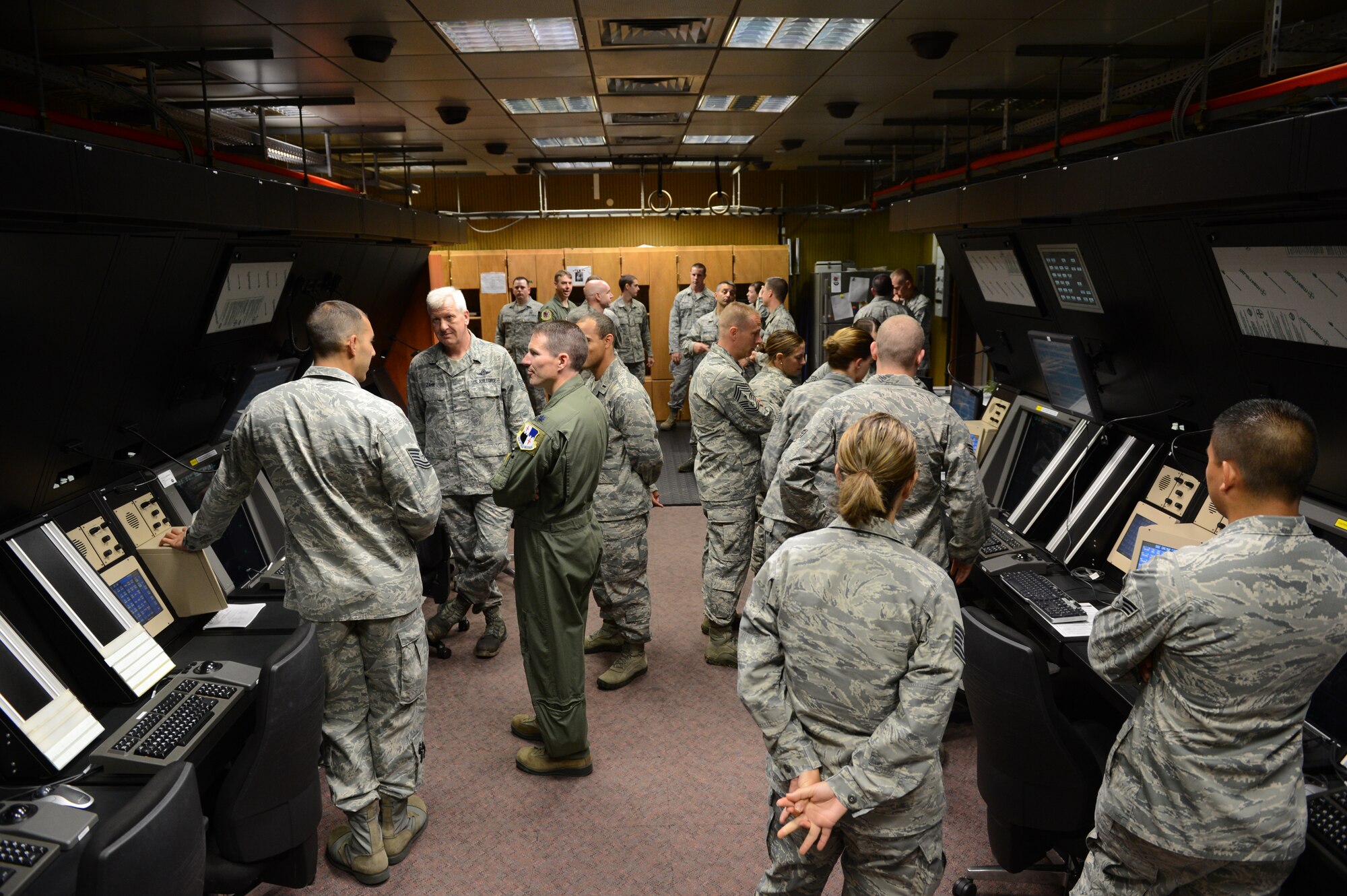 SPANGDAHLEM AIR BASE, Germany – Air traffic controllers from the 52nd Operations Support Squadron explain the new radar system to guests after the opening ceremony July 1, 2013. The $23 million upgrade brings the ground-controlled approach facility based on equipment from the 1980s to the new all-digital Standard Terminal Automation Replacement System. (U.S. Air Force photo by Staff Sgt. Nathanael Callon/Released)