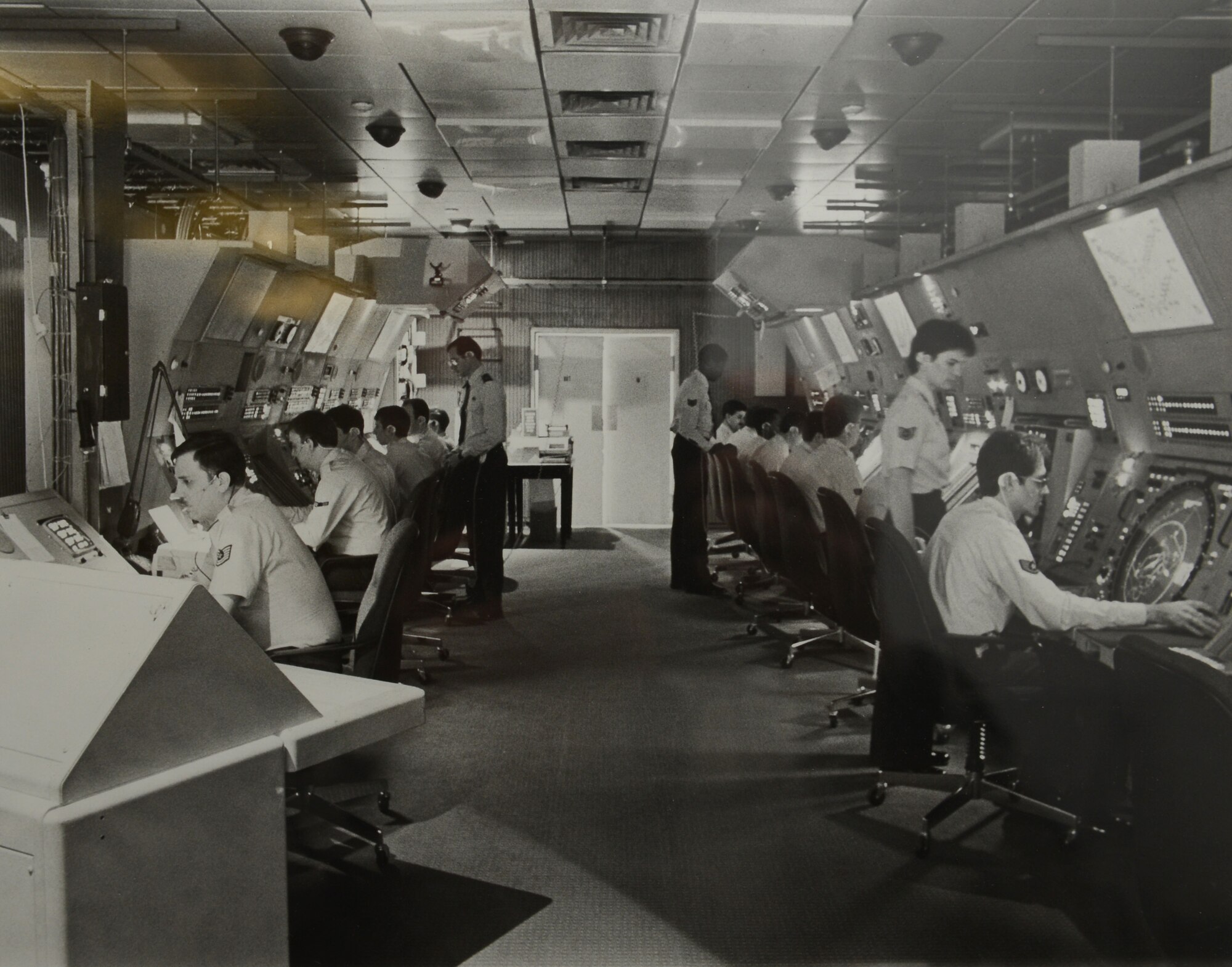 SPANGDAHLEM AIR BASE, Germany – In this undated photo, air traffic controllers work on old radar systems in the same room that the new Standard Terminal Automation Replacement System is located. The new system was a joint Federal Aviation Administration and Department of Defense endeavor to share sight pictures and information between commercial and military airfields in the United States. (U.S. Air Force photo/Released)