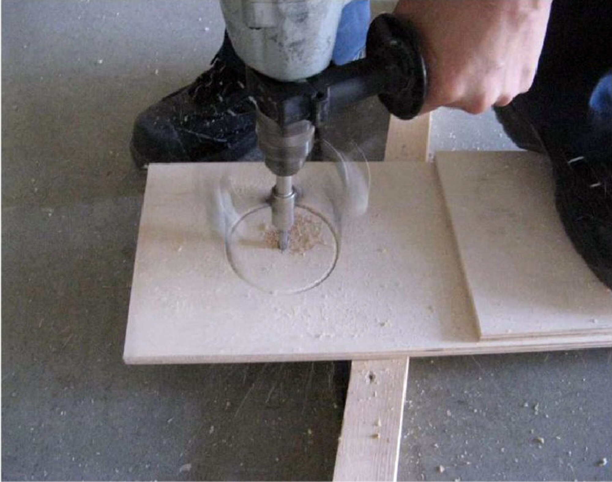 A member of the 35th Civil Engineer Squadron makes a temporary air conditioner vent window panel. Residents here are eligible to purchase portable air conditioning units for homes and dormitories, but are not yet permitted to turn them on. The news comes following the release of a policy approved June 30 by the 35th Fighter Wing Commander Col. Stephen Williams. For more information on the use of temporary air conditioning units, 35th Fighter Wing air conditioning acknowledgement memorandums, policies and regulations regarding air conditioning, visit http://www.misawa.af.mil/library/airconditioningatmisawa/index.asp. (Courtesy photo)