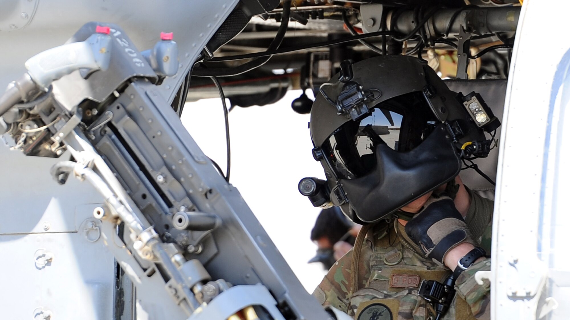 Airman 1st Class Sven Raemer, a special mission aviator with the 83rd Expeditionary Rescue Squadron, removes his gear while running his checklists after he and his fellow crew members return from a mission at Bagram Airfield June 17, 2013. Raemer was born in West Berlin, Germany, before he and his family moved to Colorado in 1993. He is deployed from RAF Lakenheath, England. (U.S. Air Force photo/Tech. Sgt. Raymond Hoy)