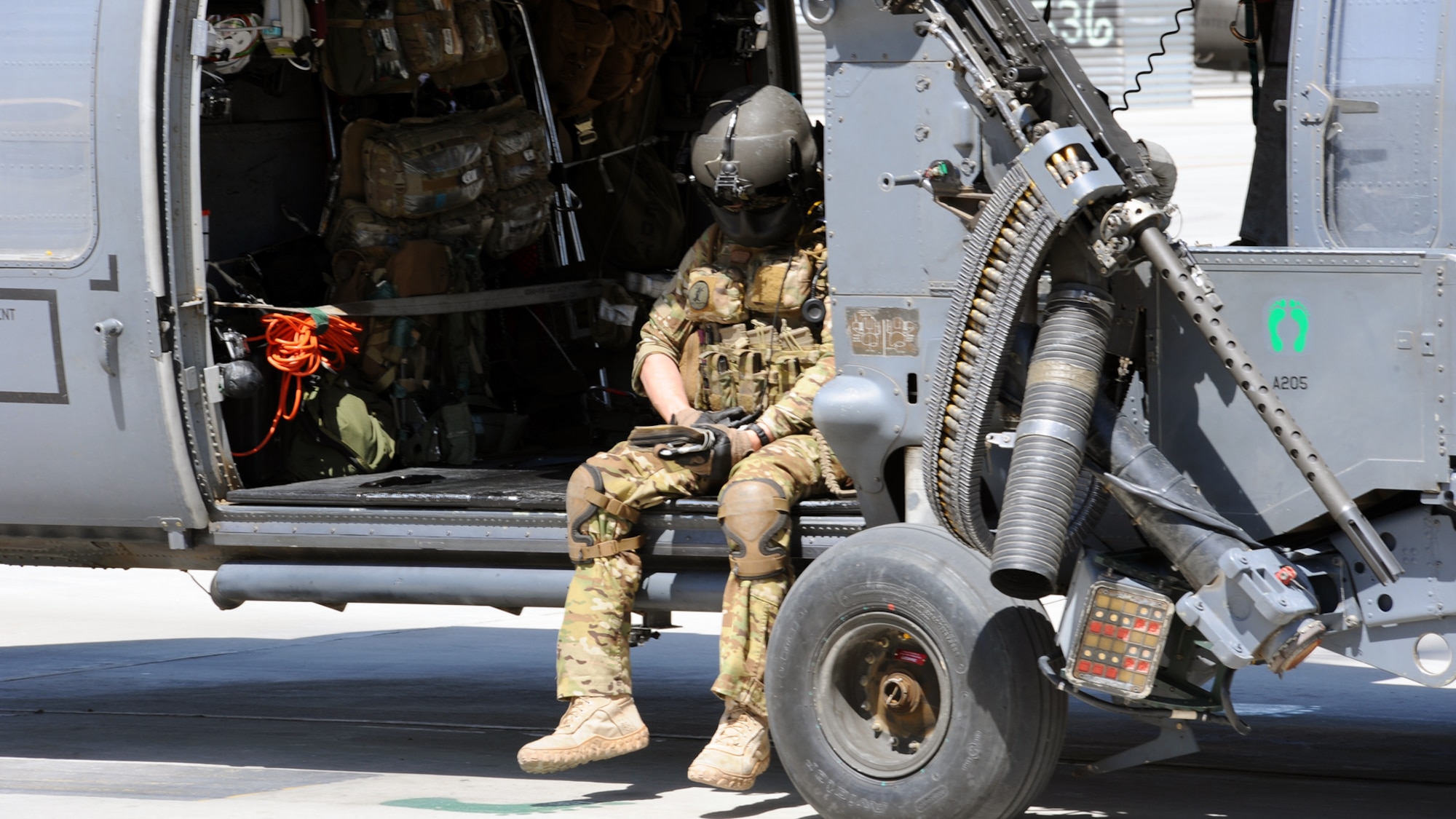 Airman 1st Class Sven Raemer, a special mission aviator with the 83rd Expeditionary Rescue Squadron, starts running his post-flight checklists as he and his fellow crew members return from a mission at Bagram Airfield June 17, 2013. Raemer was born in West Berlin, Germany, before he and his family moved to Colorado in 1993. He is deployed from RAF Lakenheath, England. (U.S. Air Force photo/Tech. Sgt. Raymond Hoy)