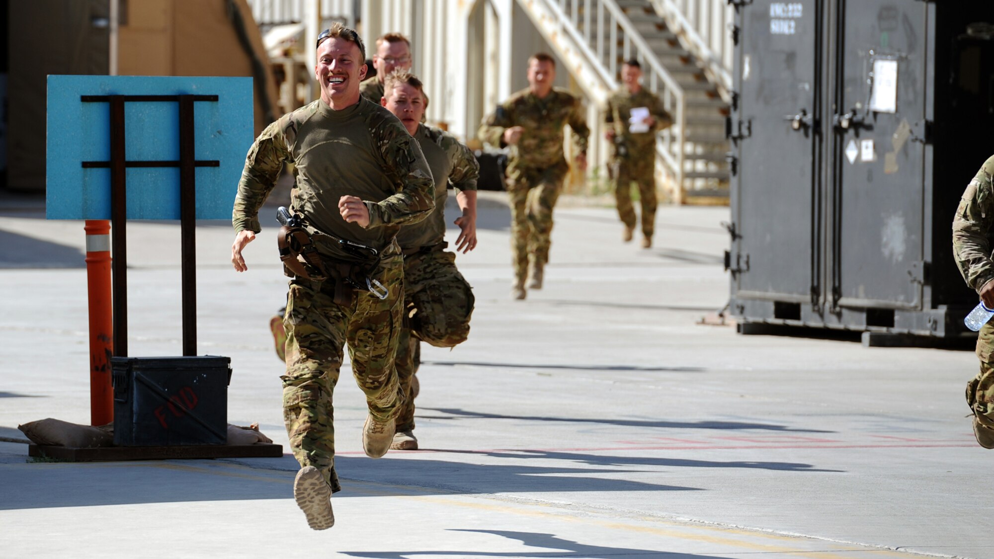 Airman 1st Class Sven Raemer, a special mission aviator with the 83rd Expeditionary Rescue Squadron, responds to a scramble call at Bagram Airfield June 17, 2013. Raemer was born in West Berlin, Germany, before he and his family moved to Colorado in 1993. He is deployed from RAF Lakenheath, England. (U.S. Air Force photo/Tech. Sgt. Raymond Hoy)