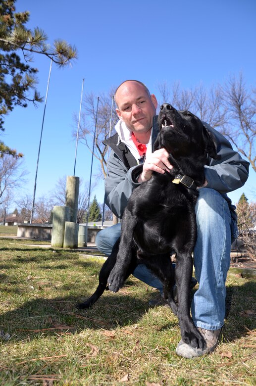 Paul Machajewski, Corps of Engineers, St. Paul District employee supporting the Red River of the North flood fight, plays with 11-month-old puppy “Chucky” at a park in Fargo, N.D., April 30. The dog’s owner, Timothy Murphy, met Machajewski to say thanks after he saved his dog during temporary levee construction in Fargo. Murphy, a published poet, also sent a poem to Machajewski to show his gratitude. According to Murphy, Chucky is an escape artist that doesn’t have a reverse gear or know how to stop. Machajewski said he was just glad to help and as a fellow dog owner, he said he knew he had to do what he could to protect the dog from harm during the levee construction.