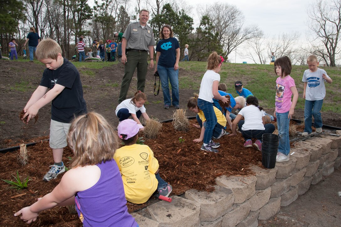 Scott Tichy, Lake Ashtabula park ranger, and Nicole Powers, Jefferson Elementary School
teacher in Valley City, N.D., celebrate the National Kids to Parks Day with the elementary
students at Baldhill Dam May 16.