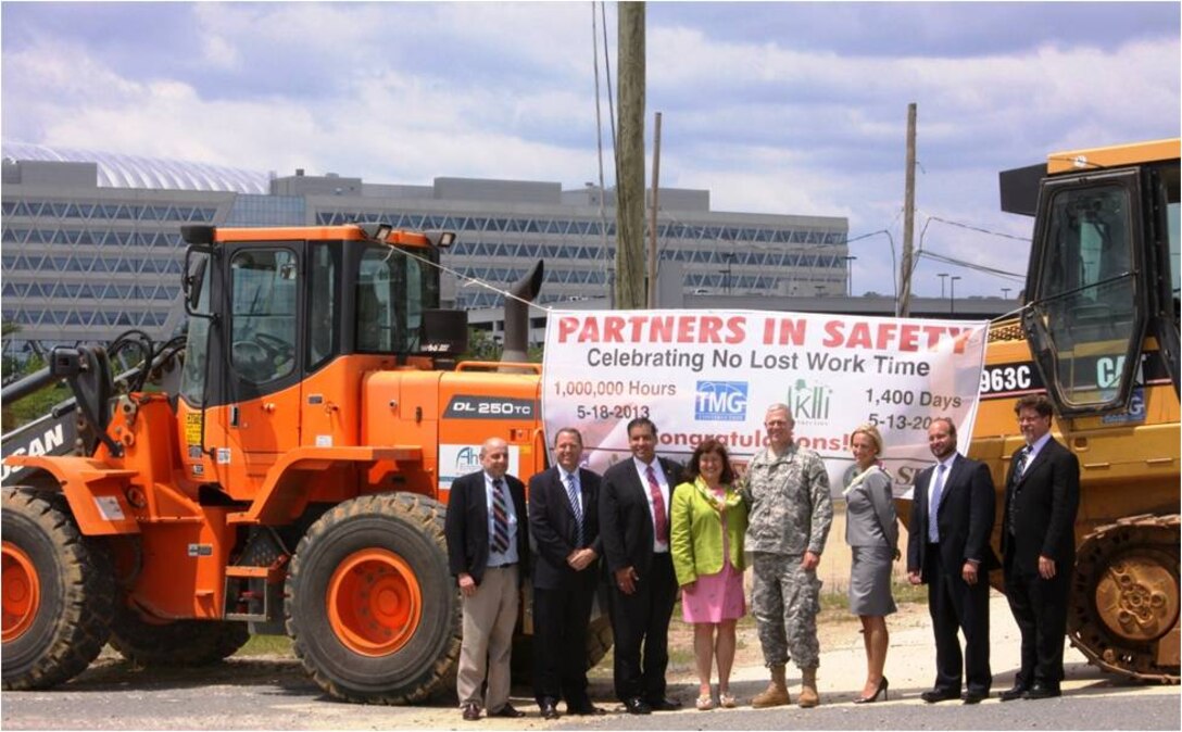 Representatives of USACE Headquarters, USACE Baltimore District, AKHI Construction, TMG Construction and Ahtna Engineering celebrate important safety milestone during construction at the Fort Belvoir New Campus East. 