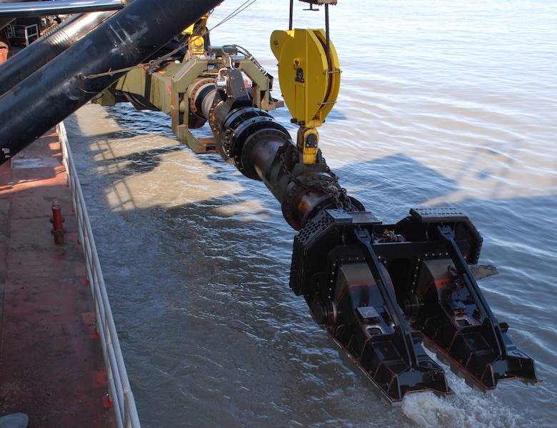 The Essayons is mechanized with a drag-arm system, pictured above, capable of dredging at a normal depth of 35 to 80 feet. Reminiscent of a fictional transforming robot, the sophisticated instruments allow constant production monitoring and enable the crew to maintain maximum efficiency 24 hours a day.