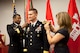 South Atlantic Division Commander Ed Jackson has stars representing Brigadier General rank pinned on his uniform by Chief of Engineers LTG Thomas Bostick and BG Jackson's wife, Lynne, in a ceremony in Atlanta on July 1.