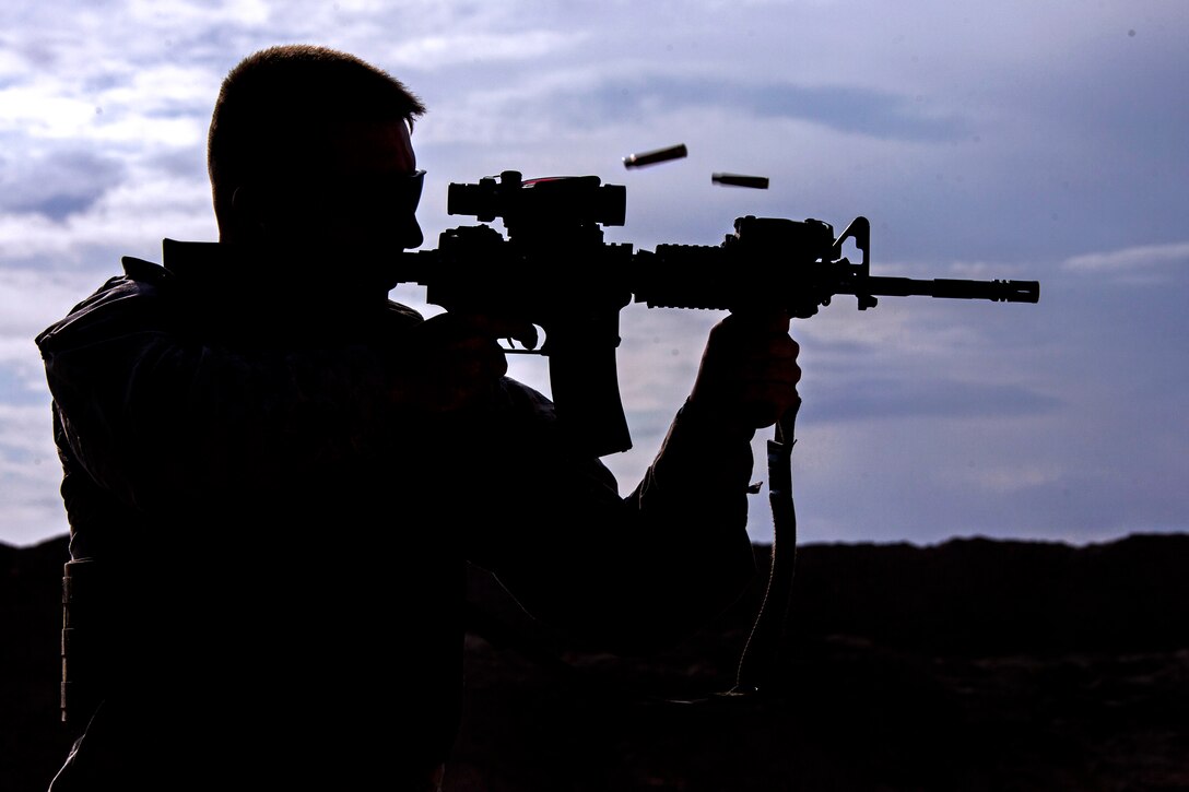 U.S. Marine Corps Staff Sgt. Jeremy Masters engages his target during a foreign weapons and NATO ballistics live-fire shoot on Camp Leatherneck in Helmand province, Afghanistan, July 1, 2013. Masters is assigned to Regimental Combat Team 7.