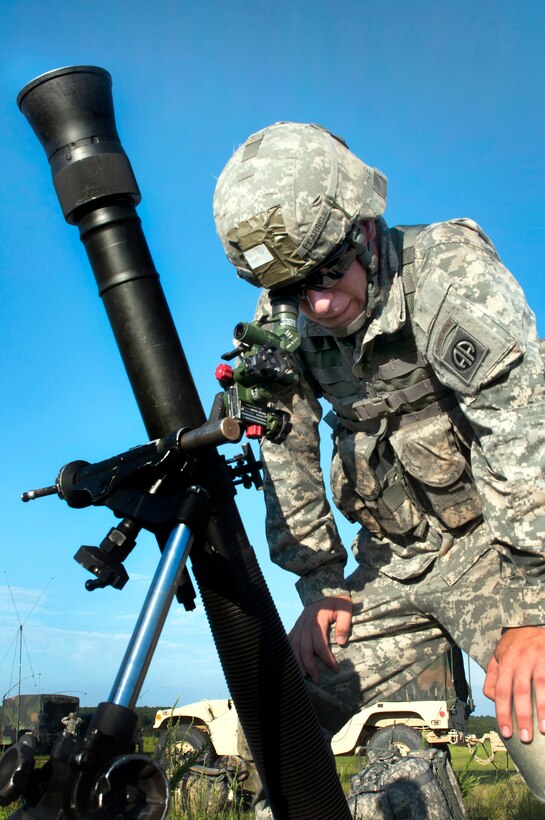 Army Spc. Benjamin Farrell lays the mortar tube and checks for his target during Operation Fury Thunder on Fort Bragg, N.C., June 22, 2013. Farrell, a mortarman, is assigned to the 82nd Airborne Division's Headquarters Company, 1st Battalion, 508th Parachute Infantry Regiment, 4th Brigade Combat Team.