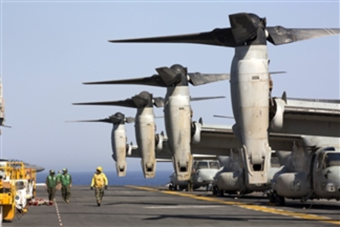 U.S. Navy sailors and Marines prepare to launch MV-22 Ospreys from the amphibious assault ship USS Kearsarge (LHD 3) as the ship operates in the Red Sea on June 30, 2013.  The Kearsarge Amphibious Ready Group and the embarked 26th Marine Expeditionary Unit are deployed in support of maritime security operations and theater security cooperation efforts in the U.S. 5th Fleet area of responsibility.  