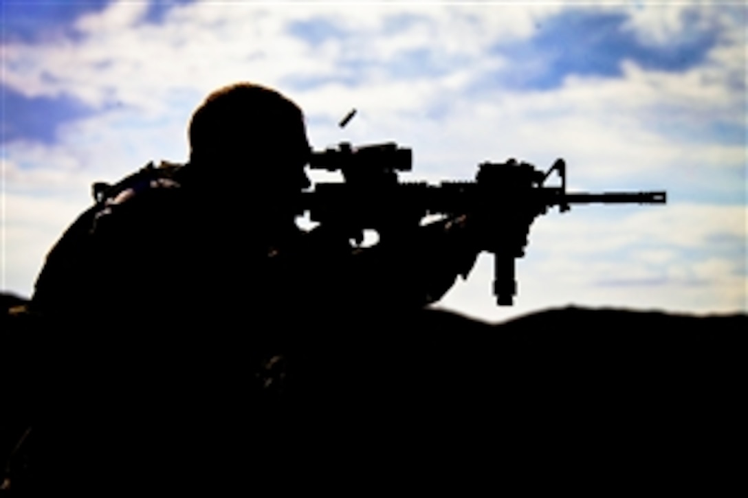 U.S. Marine Corps Cpl. Stephen Dodd engages his target during a foreign weapons and NATO ballistics live-fire shoot on Camp Leatherneck in Helmand province, Afghanistan, July 1, 2013. The Marines conducted the shoot to ensure serviceabilty of the weapons systems. Dodd is assigned to Regimental Combat Team 7.