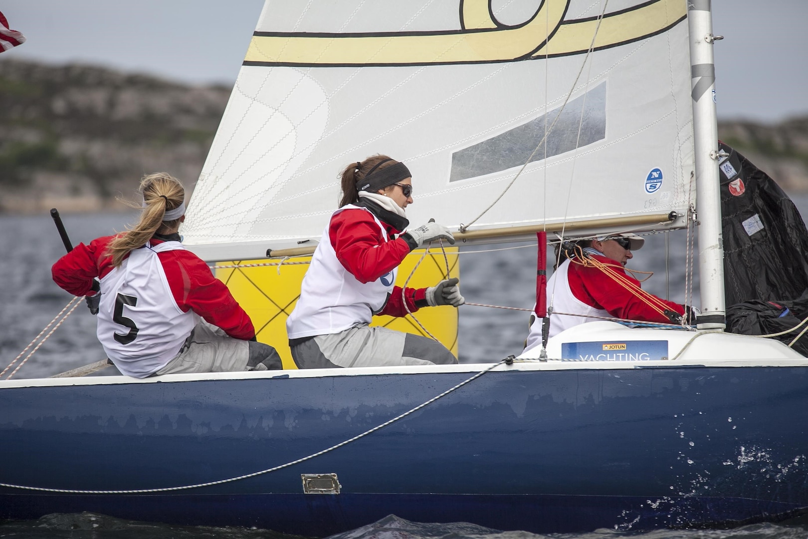 US Women wrap up day three holding steady in third place during the 2013 CISM World Military Sailing Championship at the Askoy Yacht Club in Bergen, Norway.  Left to right is: Skipper, LT Trisha Kutkiewicz (Navy) and crewmembers LTJG Kyrsta Rohde (USCG) and LT Elizabeth Tufts (USCG).