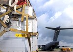 Oil spill containment boom sits on a truck at Naval Air Station Joint Reserve Base (NAS JRB) New Orleans after being off-loaded from an Air Force C-17, from Anchorage, Alaska. The boom will be used to support Deepwater Horizon oil spill response. Deepwater Horizon was an ultra-deepwater oil rig located 130 miles southeast of New Orleans that exploded April 20 and sank April 22, causing a massive oil spill threatening the U.S. Gulf Coast. 
