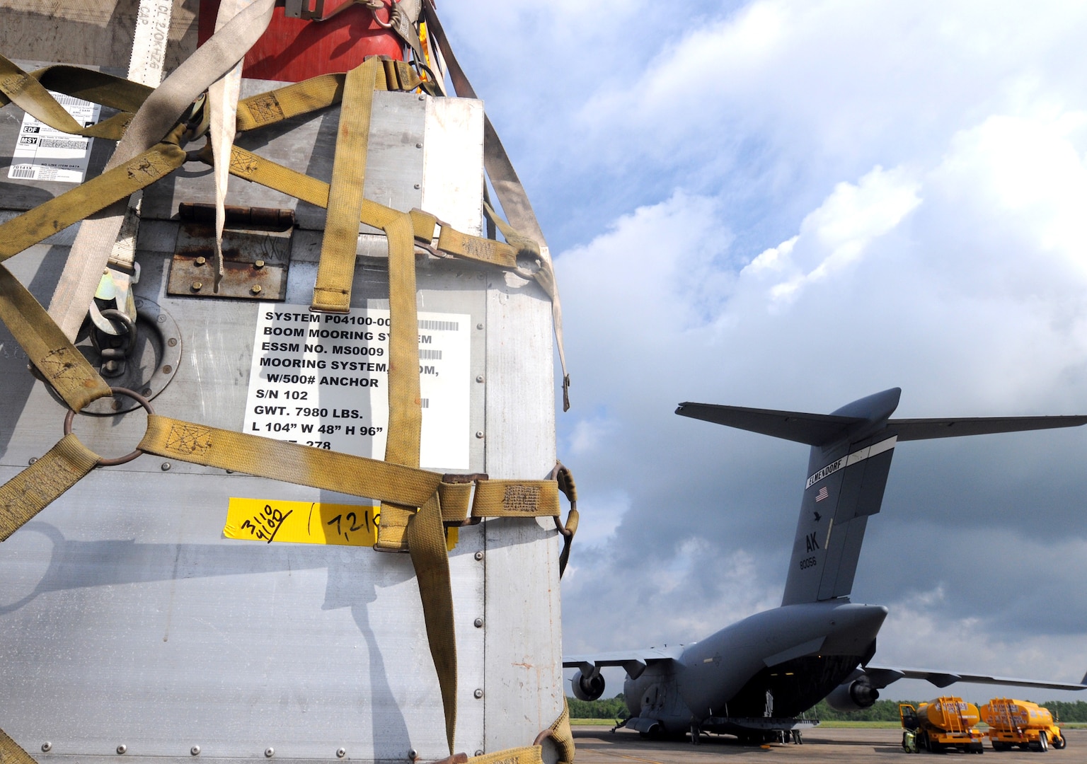 Oil spill containment boom sits on a truck at Naval Air Station Joint Reserve Base (NAS JRB) New Orleans after being off-loaded from an Air Force C-17, from Anchorage, Alaska. The boom will be used to support Deepwater Horizon oil spill response. Deepwater Horizon was an ultra-deepwater oil rig located 130 miles southeast of New Orleans that exploded April 20 and sank April 22, causing a massive oil spill threatening the U.S. Gulf Coast. 