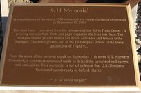 The plaque of the new 9-11 memorial describes the design of the memorial and its three parts, the steel beam representing the World Trade Center, the five-sided planter representing the Pentagon, and Pennsylvania soil representing crash site of Flight 93. The memorial will be commemorated in a ceremony at 1 p.m. May 18. 

