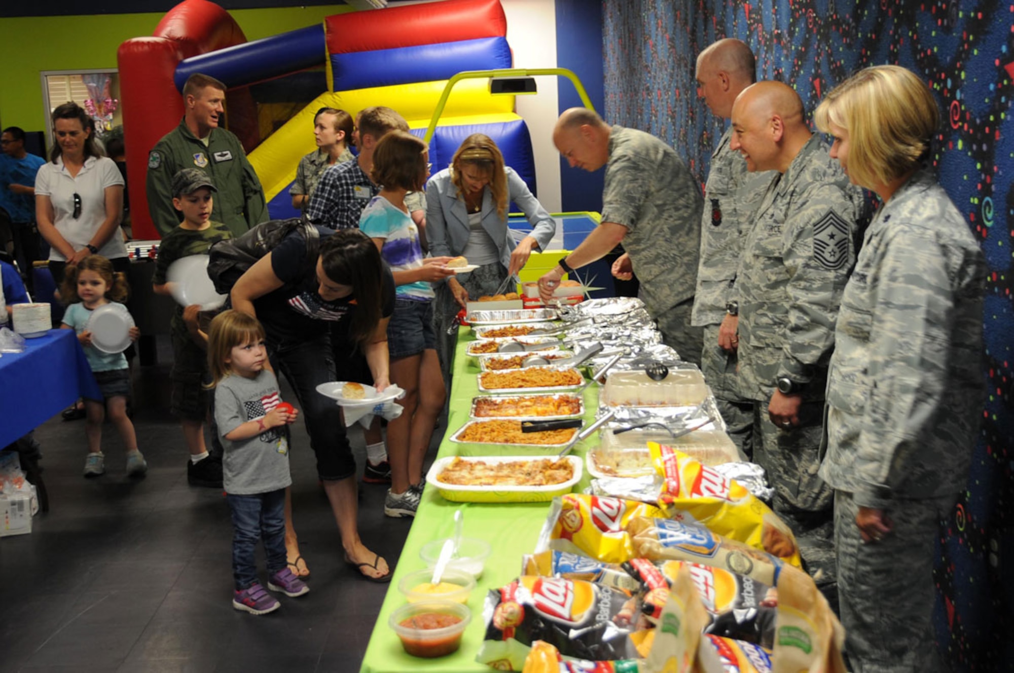 Families of deployed service members enjoy food, games, and prizes at the Deployed Spouses Dinner, June 27. The dinner, supported by the JBER Company Grade Officers’ Council, the First Sergeants’ Council and other service member volunteers, provided parents with a respite from having to cook for their families and a chance to connect with other spouses, while their loved ones are serving abroad. (U.S. Air Force photos/Staff Sgt. William Banton)
