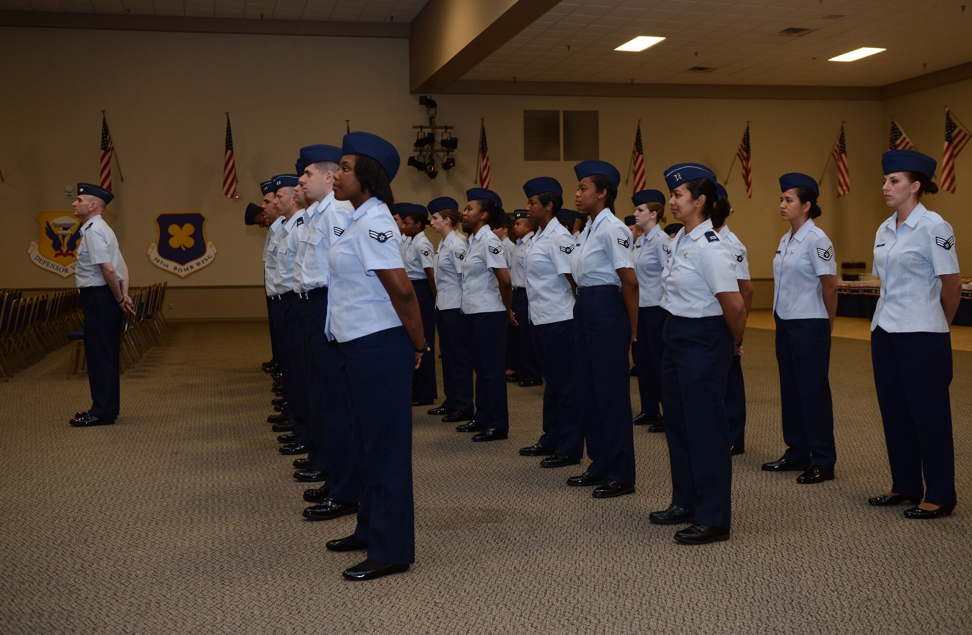 Personnel from the 2nd Medical Group stand at ease during the 2nd MDG change-of-command ceremony on Barksdale Air Force Base, La., June 3, 2013. Airmen participated in this ceremony as a final send off to their outgoing commander and as a warm welcome to their incoming commander. (U.S. Air Force photo/Capt. William Graff)
